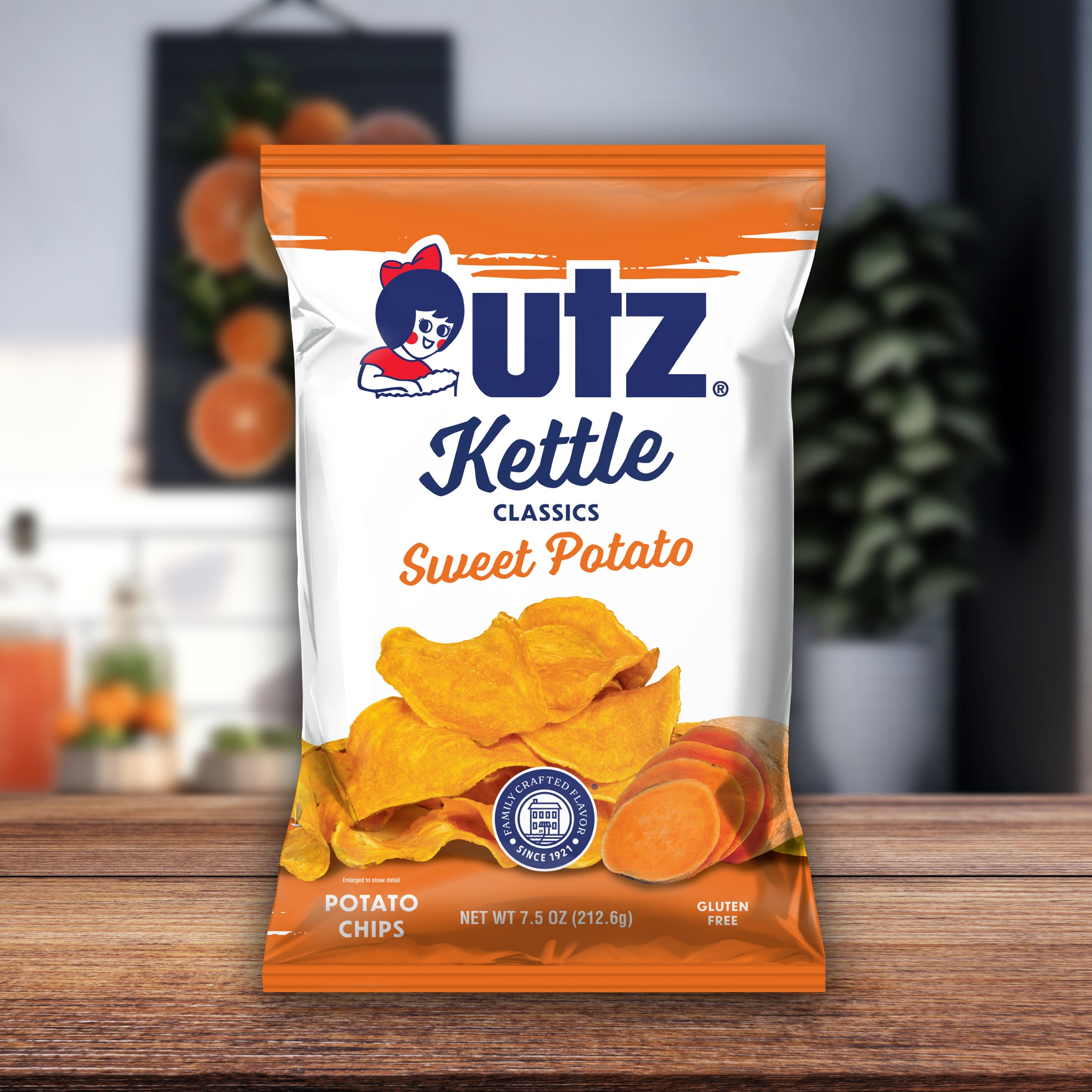 UTZ Kettle Classics Sweet Potato chips packaging on a wooden surface with a blurred background