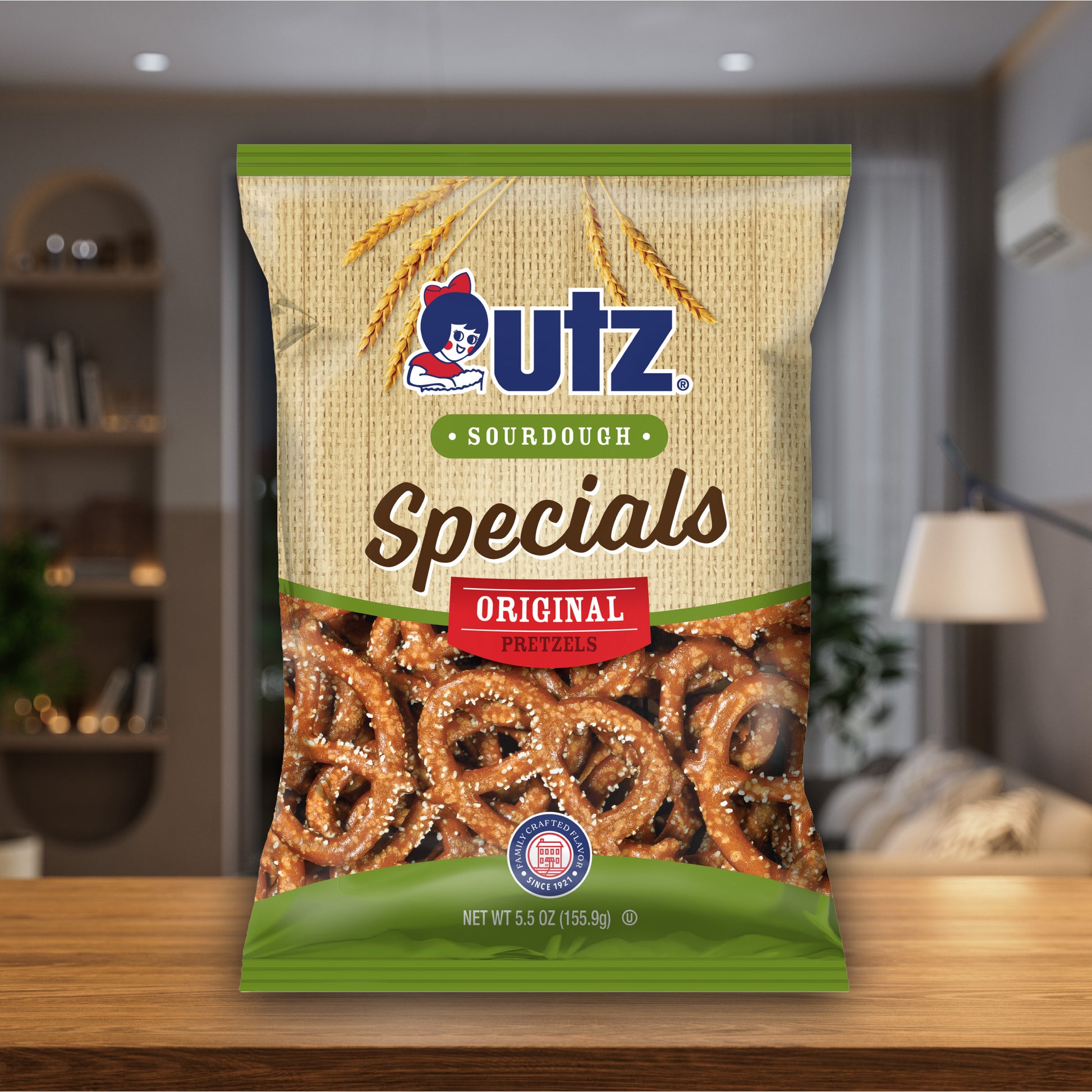 UTZ Sourdough Specials pretzel package on a wooden surface with a blurred indoor background