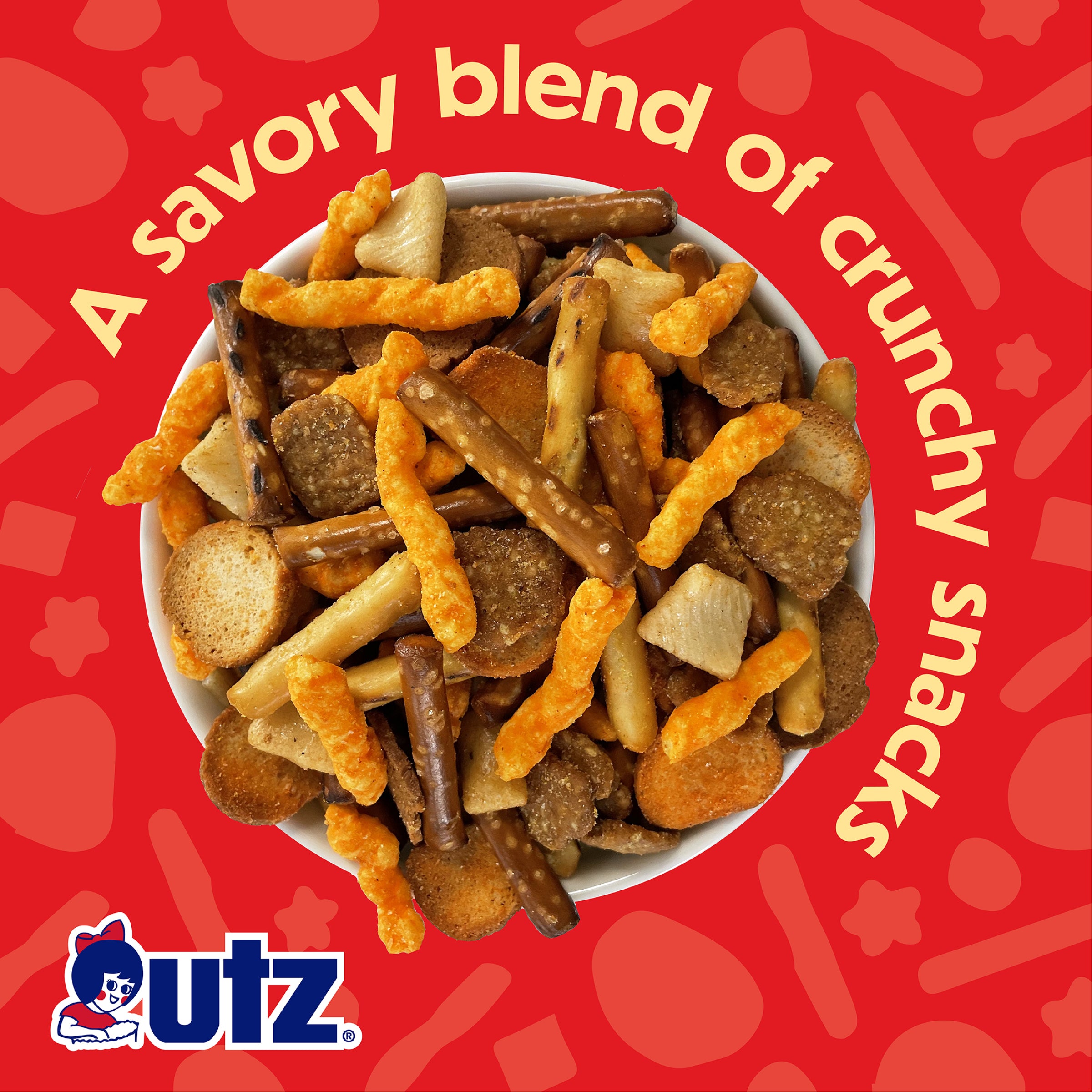 Image of a bowl filled with a mix of crunchy snacks, including pretzel sticks, cheese curls, and rye chips, against a red background. Text reads 'A savory blend of crunchy snacks' with the Utz logo displayed at the bottom.