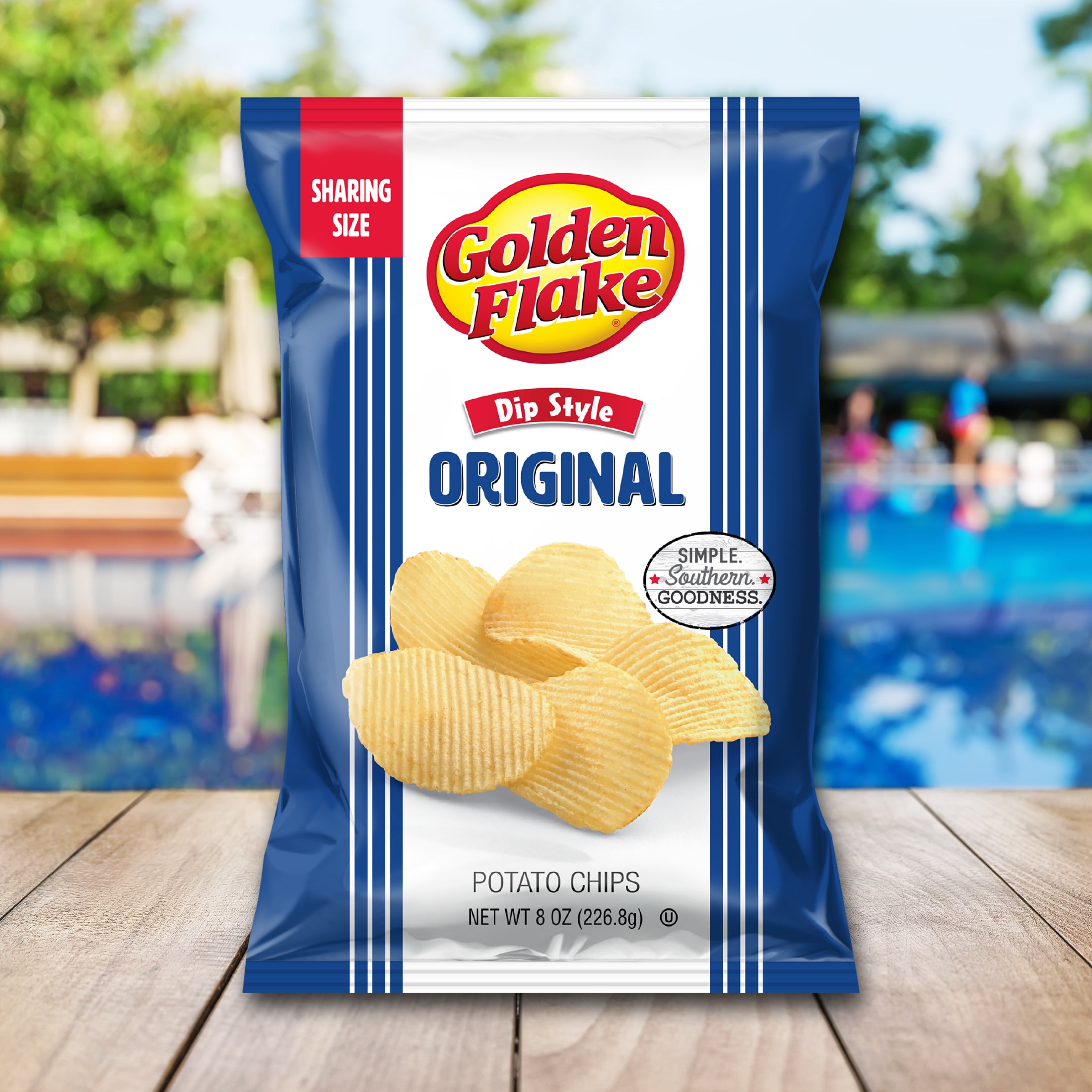 Packaging of Golden Flake Original Dip Style Potato Chips with a blurred outdoor background