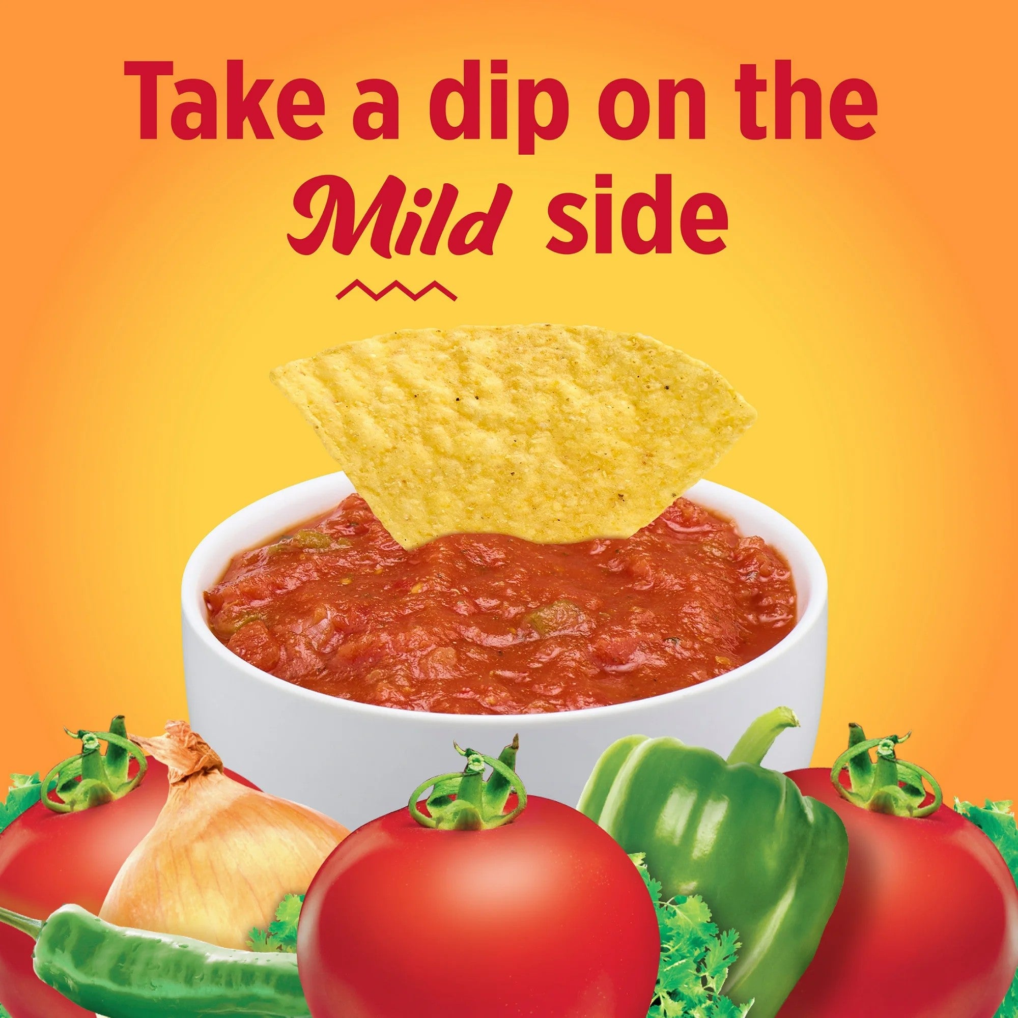 Tortilla chip dipping into salsa with tomatoes and peppers on a yellow background
