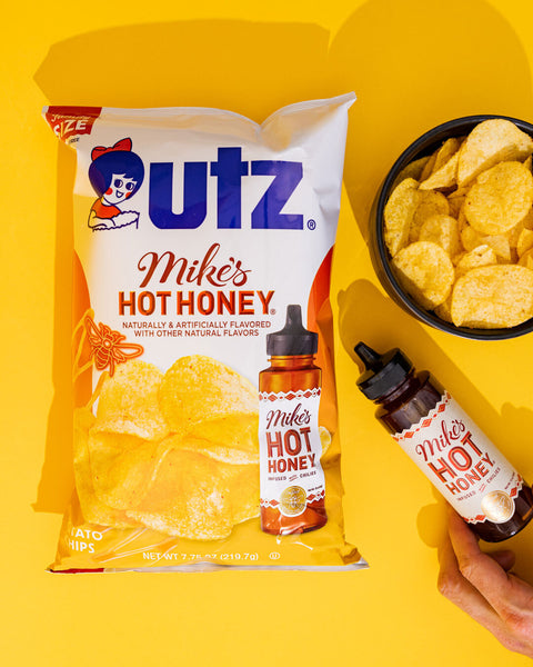 UTZ Mike's Hot Honey potato chips packaging with a bottle of hot honey on a yellow background
