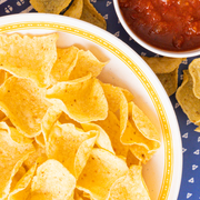 Pasta salad with tortilla chips and salsa in a bowl